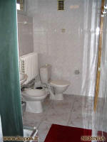 shower cabin, sink, bidet and WC.